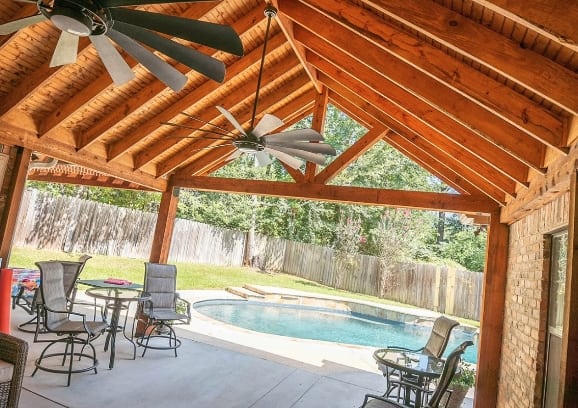 inside view of porch and patio leading to backyard pool