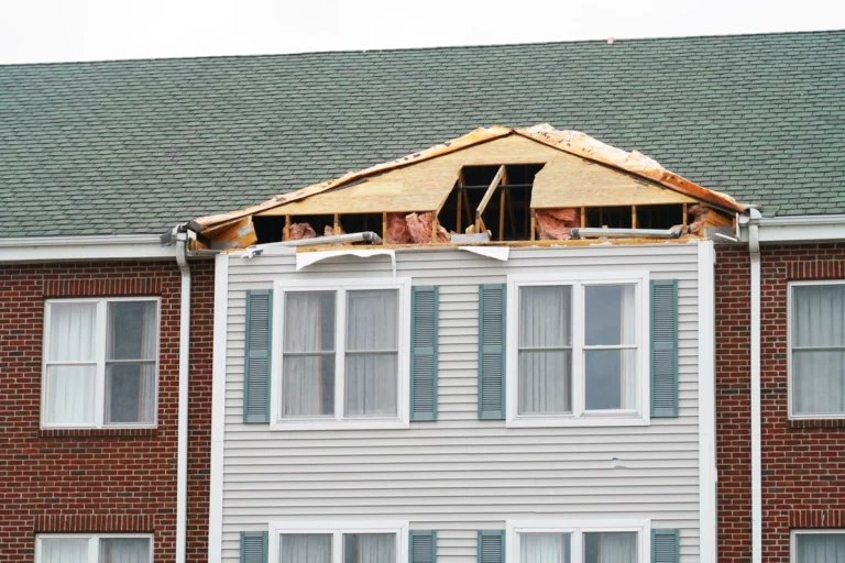 roof damage on the apartment building