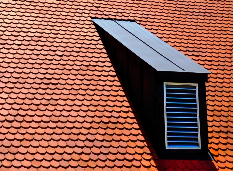 luxury house roof with red clay tiles and roof dormer
