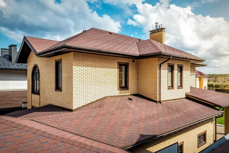 large house with red asphalt shingles