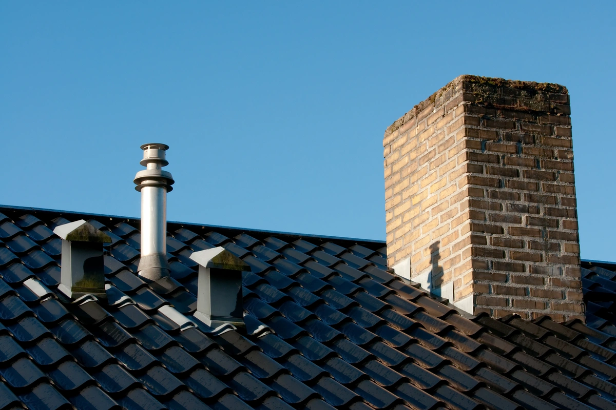 black tile roof and chimney flashing