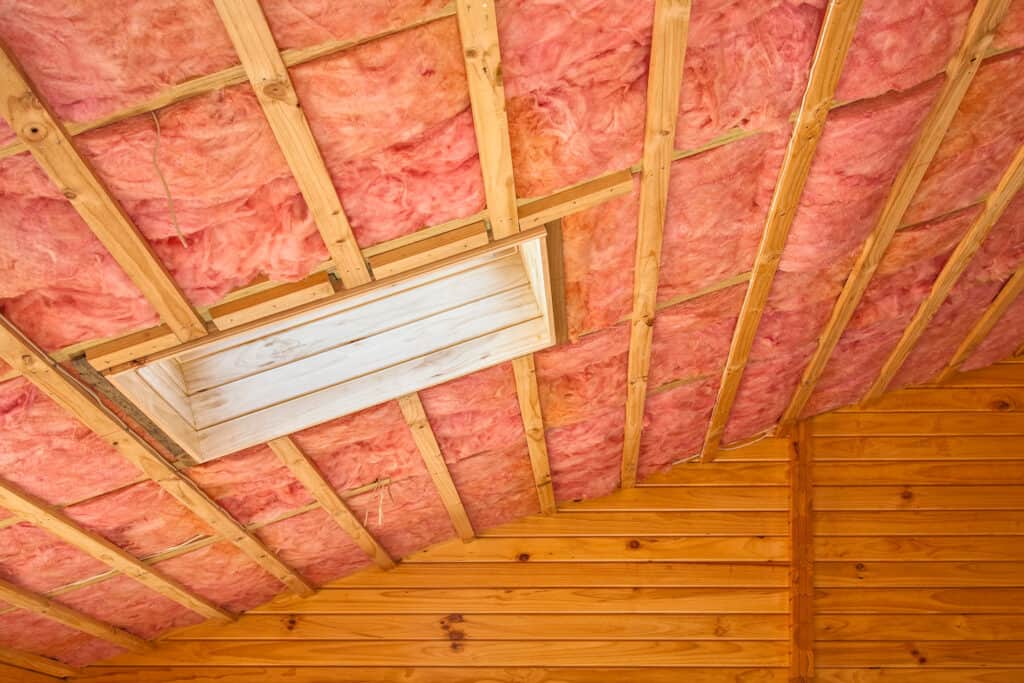 Fiberglass insulation installed under roof