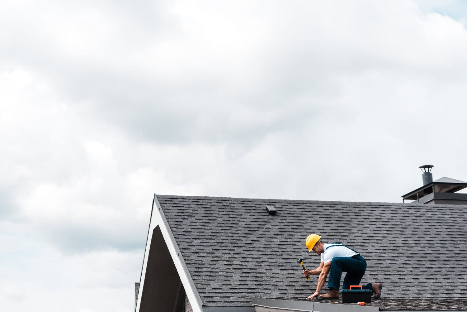 A man demonstrating how to find a roof leak and fix it