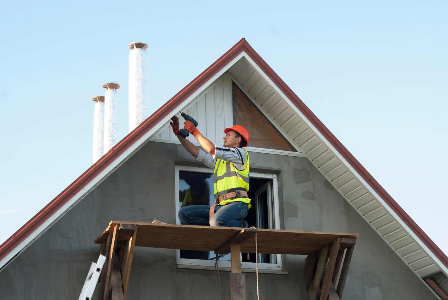 A worker in soffit repair