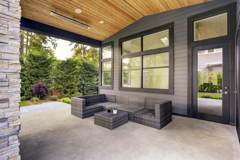 window replacement-covered porch with new windows and outdoor furniture