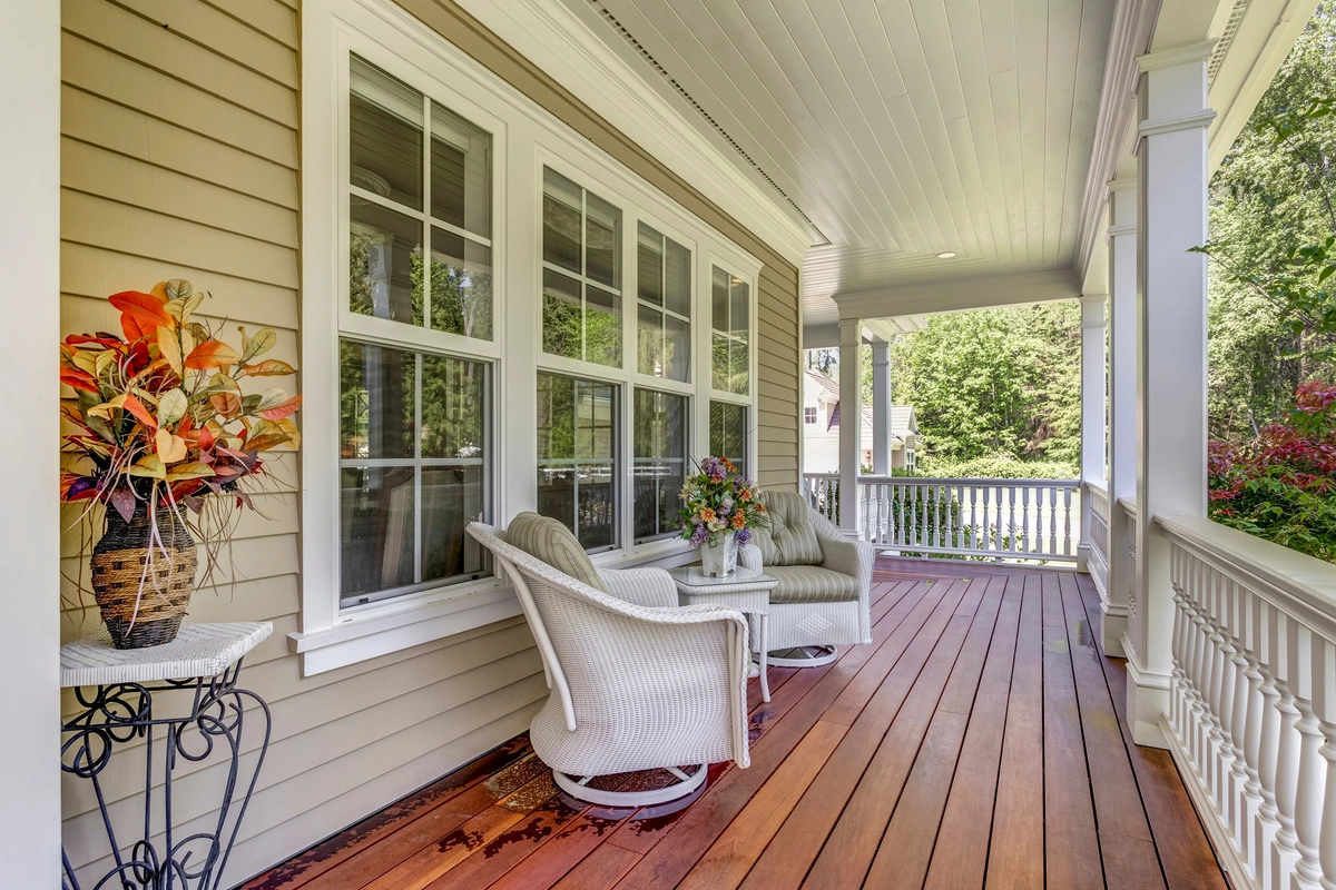 window replacement-wrap around porch with new windows behind outdoor seating