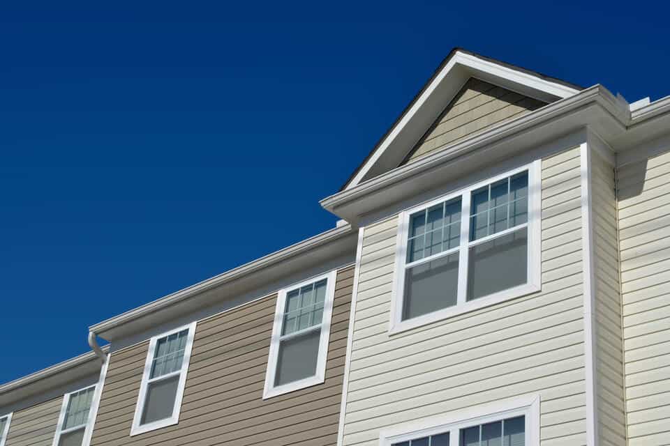 double hung window-close up of double hung window on cream sided house