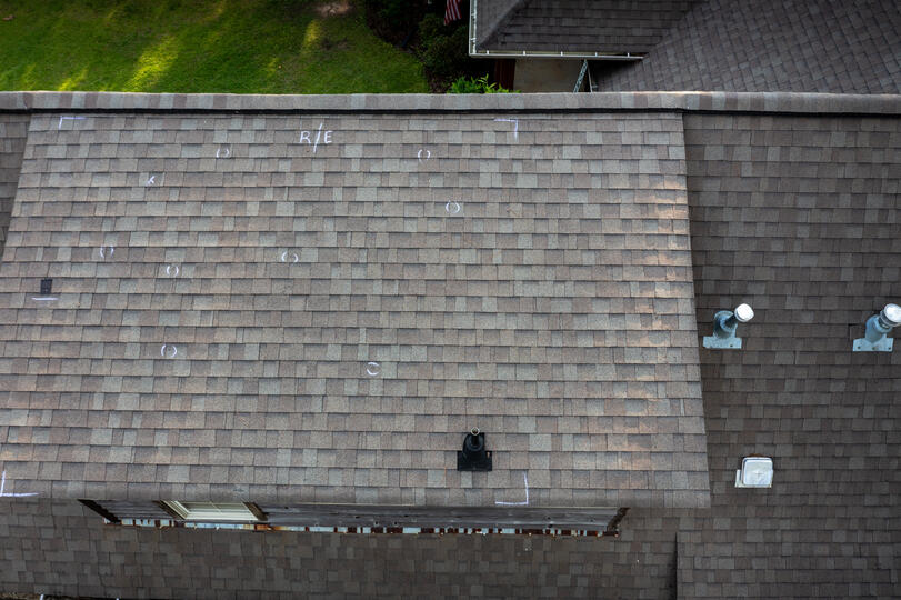 hail damage roof repair-arial view of a roof with marked hail damage spots