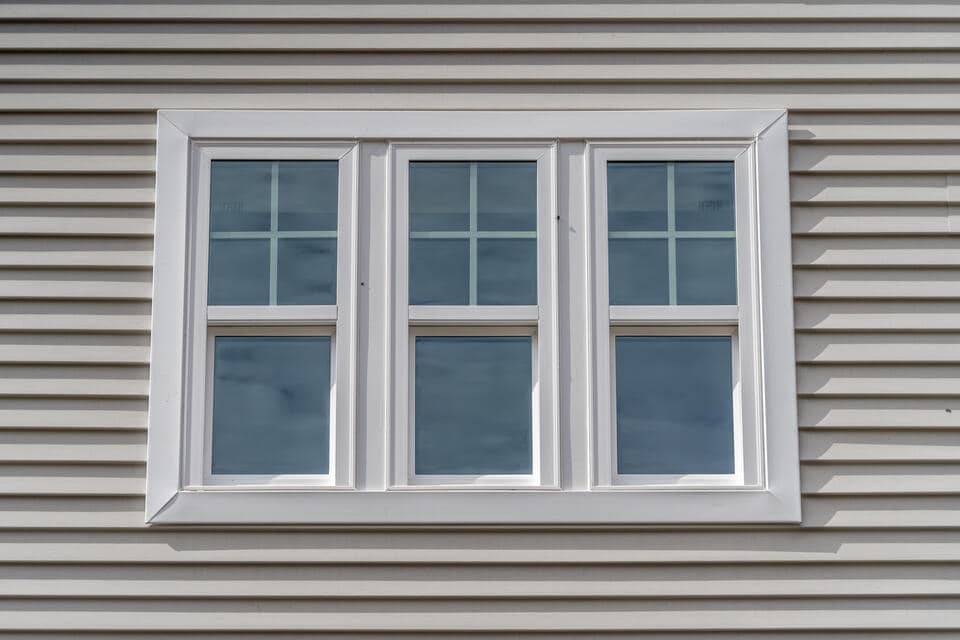 vinyl windows-white sided house with vinyl windows