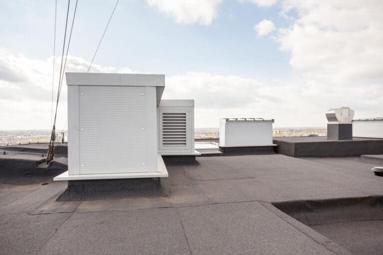 newly renovated commercial roofing with white hvac appliances