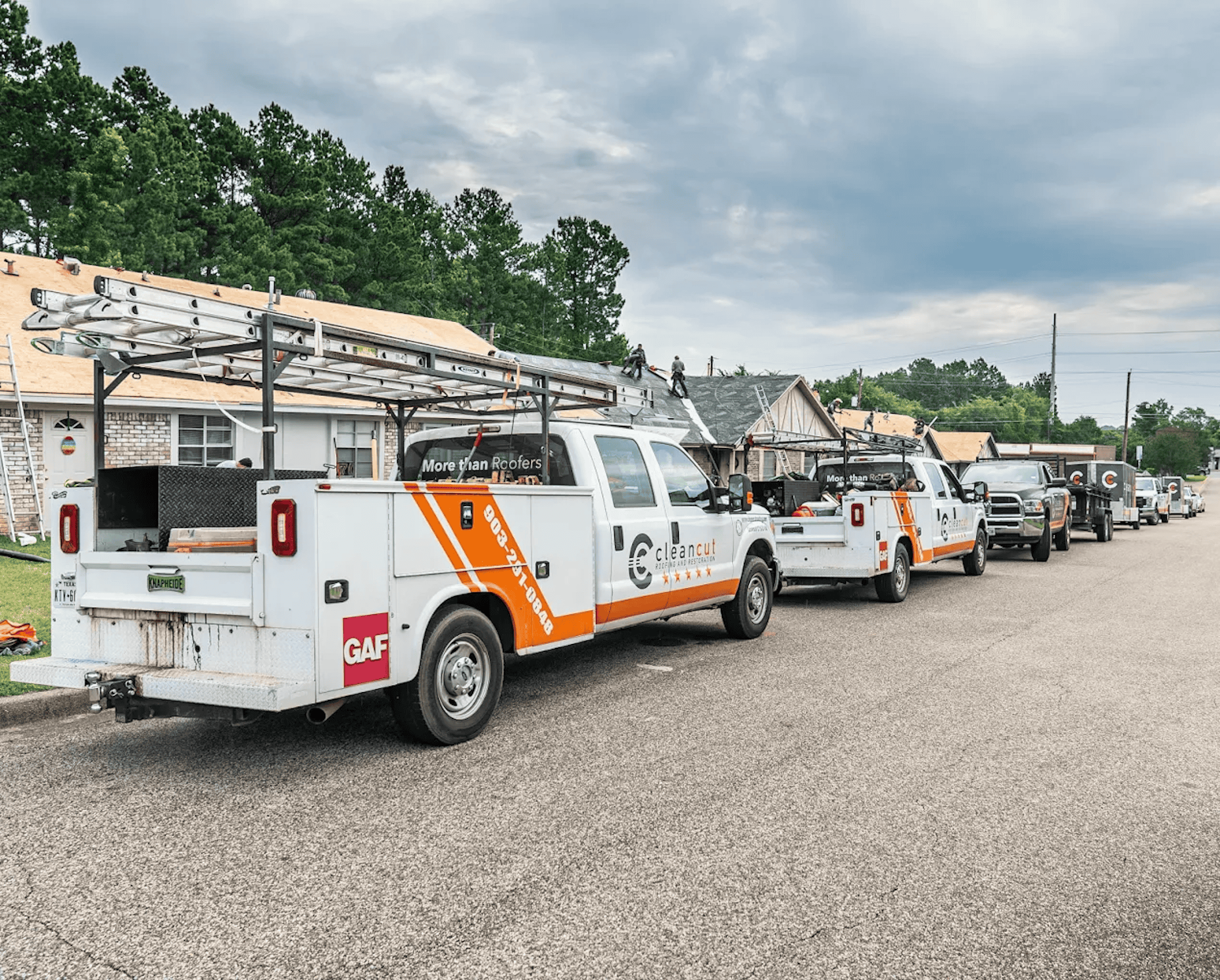 Clean cut roofing trucks