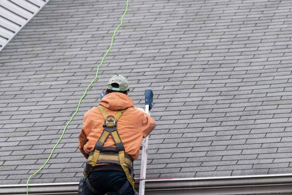 Worker on roof inspection